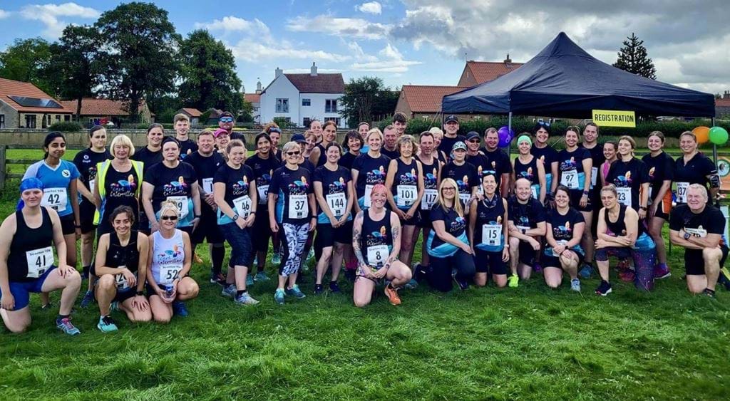 Team Caterpillar Group Photo Featured