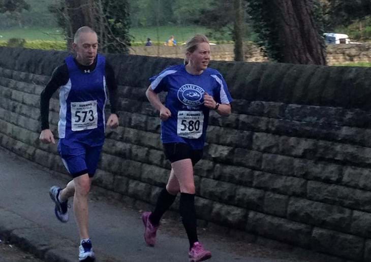 couple running on pavement