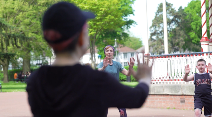 Jolly Joggers group in a park doing group stretching